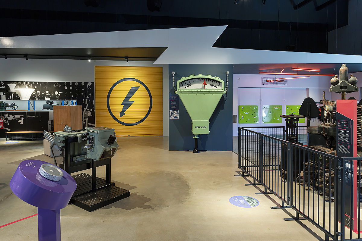 view inside electricity museum with museum objects and bright coloured walls